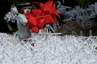 A Sri Lankan vendor sells lanterns from a stall in Colombo