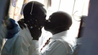 Gay men kiss in Kenya