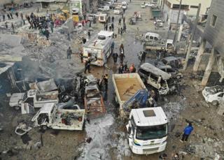 Rescue teams at the site of an air strike on Syria's last major opposition bastion of Idlib on January 15, 2020