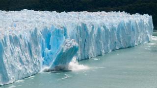 A giant piece of ice breaks off the Perito Moreno Glacier in Patagonia, Argentina.
