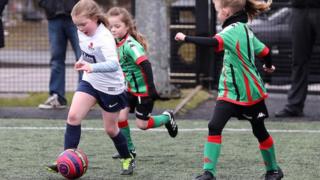 girls playing football