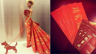 A doll dressed in red with money envelopes