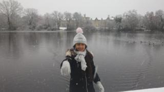 Girl in hat outside in snow