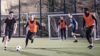 People playing five-a-side football