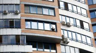 A view shows a broken window in a multi-storey apartment block following a reported drone attack in Moscow, Russia, May 30, 2023.