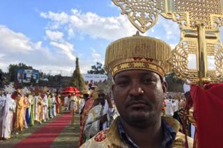 A priest stands in Meskel Square