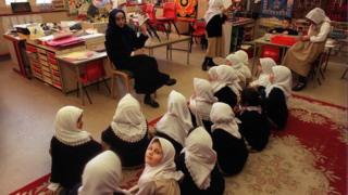 Teacher reads to her class