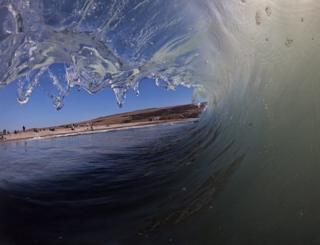 A shore break captured from within the wave