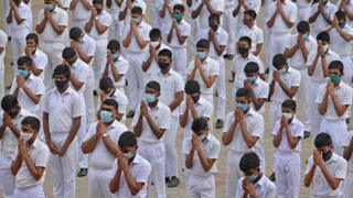 Students in Sri Lanka wear face masks