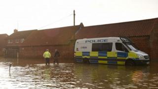 Police van in flood-hit Fishlake, South Yorkshire