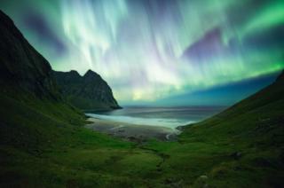 Northern lights above a beach