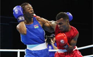 Jone Davule of Fiji and Louis Richarno Collin of Maritius compete in boxing