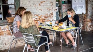 A group eating fried chicken outside a restaurant in Texas.