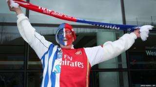 Fan waving scarf in the air