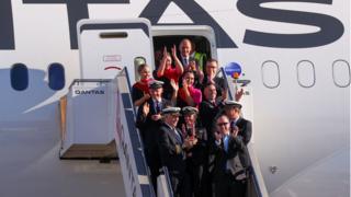 Qantas Group CEO Alan Joyce and crew after arriving at Sydney airport after completing a non-stop test flight from New York