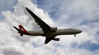A Qantas aeroplane comes in to land at Melbourne Tullamarine Airport