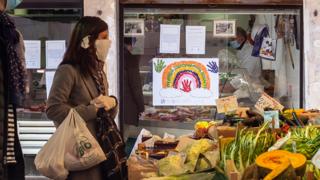 Shopper wears face mask in Italy