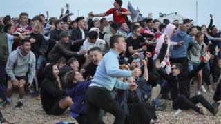   England fans at Brighton beach after the winner 
