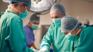 surgeons in operating theatre