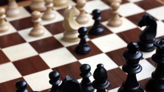 A close-up image of a chess board