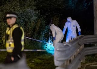 Forensic officers at the scene