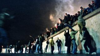 Moment from when the Berlin Wall came down