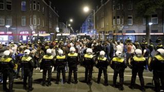 Dutch police on duty during a riot in the Schilderswijk district of The Hague