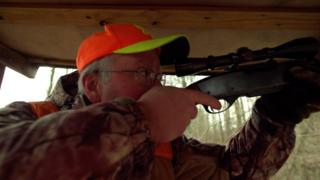 Man shooting a hunting rifle