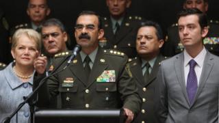 Colombia"s General Rodolfo Palomino, the head of the national police, accompanied by his wife and his children, speaks during a news conference in Bogota, Colombia, February 17, 201