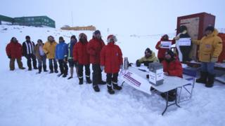 Australians based at the Davis station in Antarctica line up to cast their vote in the 2016 election