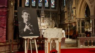A picture of late Irish singer Shane MacGowan is displayed on the day of his funeral procession, in Tipperary, Ireland, 8 December 2023.