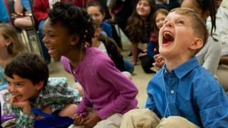 Three children laughing