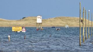 holy island bbc submerged rescued causeway five cars pratt graham source