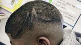 A teenager, showed with his faded hair style coloured in with a black marker pen by school officials