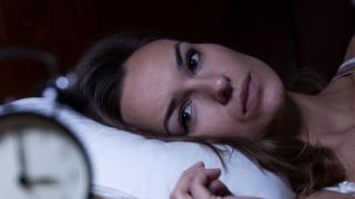 Woman struggling to sleep