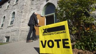 A voter walks into a polling station in Canada