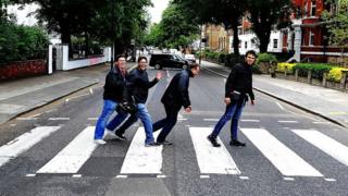 Marcelo almost falls over when trying to recreate the famous Beatles photo.