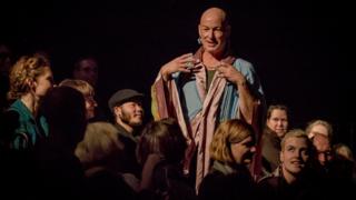 Jacob Boehme performs among audience members for his show, Blood on the Dance Floor