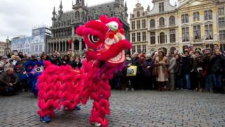 People watch the Chinese Lunar New Year celebrations parade for the beginning of the Year of the Monkey in Brussels in Belgium
