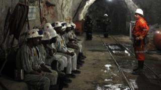 Miners attend a security briefing on October 10, 2013 at the Cullinan Diamond Mine, north-east of Johannesburg.