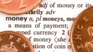 Coins on dictionary