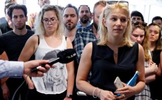 Deputy editor in chief Veronika Munk speaks surrounded by employees at Index.hu on 24 July