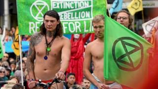 Extinction Rebellion activists block an intersection in Melbourne