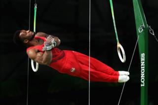 Courtney Tulloch of England competes in the men's team final and individual qualification in artistic gymnastics