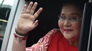 The former first lady of the Philippines, Imelda Marcos, greets the crowd as she arrives for her son, the vice presidential candidate, Ferdinand Marcos Jnr, performing in Manila on May 5, 2016.