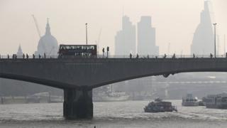 File image from 10 April 2015 of London's Waterloo Bridge, with St Paul's Cathedral visible through smog in the background