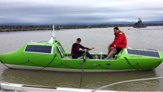 the two men are pictured on their rowing vesell