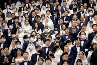 in_pictures Thousands of couples attend a mass wedding