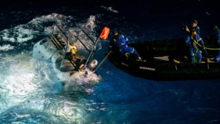 The DSV Limiting Factor submersible (left) prepares for a dive
