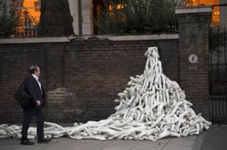 Piles on mannequin limbs are seen outside the Russia's embassy in London